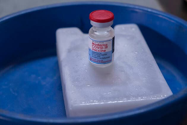 Bangladesh begins nationwide Covid-19 vaccination drive A vial of Moderna Covid-19 Vaccine sits upon a icebox. Dhaka Bangladesh Lalmatia Copyright: RizwanxHasan