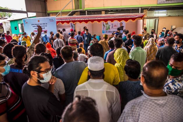 August 7, 2021, Barishal, Barishal, Bangladesh: People gathering to get themselves inoculated with the Moderna Covid-19 coronavirus vaccine during a mass vaccination camp starting today at Barishal City, Bangladesh on August 7, 2021. Barishal Bangladesh - ZUMAr337 20210807_zip_r337_001 Copyright: xMustasinurxRahmanxAlvix