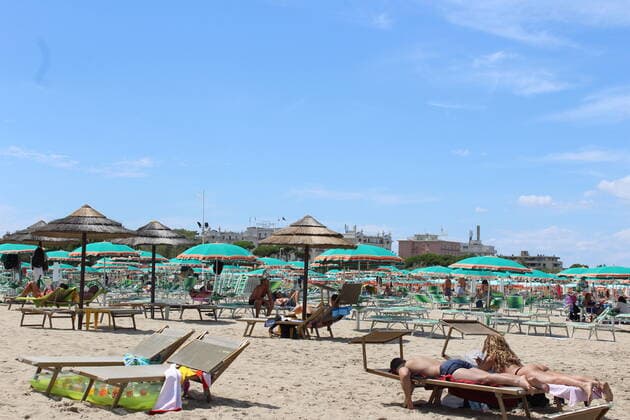 August 6, 2021, Rimini, Italy: Green pass doesn t stop Ferragosto, the Italians mid-August vacation on the beaches. In Rimini and Rivieira Romanhola region, the coast is starting to get crowded even with the green certificate being mandatory. And there are many tourists arriving in the city. Since the 6th of August, the Green Pass is mandatory in Italy. Green Pass is mandatory only to enter some closed places, such as restaurants and bars, if you intend to sit and eat at the table, but also in discos, museums, exhibitions, gyms, swimming pools, amusement parks, parties and health centers. The Government extended the mandatory green pass also for access to long-distance trains and planes. Copyright: xJosixDonellix