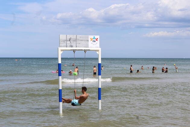 August 6, 2021, Rimini, Italy: Green pass doesn t stop Ferragosto, the Italians mid-August vacation on the beaches. In Rimini and Rivieira Romanhola region, the coast is starting to get crowded even with the green certificate being mandatory. And there are many tourists arriving in the city. Since the 6th of August, the Green Pass is mandatory in Italy. Green Pass is mandatory only to enter some closed places, such as restaurants and bars, if you intend to sit and eat at the table, but also in discos, museums, exhibitions, gyms, swimming pools, amusement parks, parties and health centers. The Government extended the mandatory green pass also for access to long-distance trains and planes. Copyright: xJosixDonellix