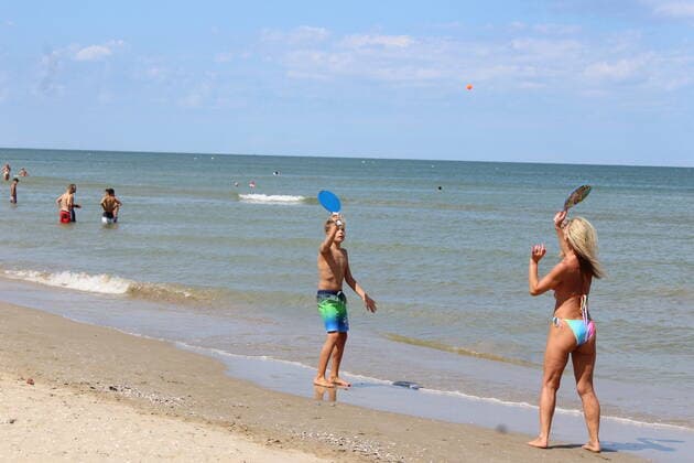August 6, 2021, Rimini, Italy: Green pass doesn t stop Ferragosto, the Italians mid-August vacation on the beaches. In Rimini and Rivieira Romanhola region, the coast is starting to get crowded even with the green certificate being mandatory. And there are many tourists arriving in the city. Since the 6th of August, the Green Pass is mandatory in Italy. Green Pass is mandatory only to enter some closed places, such as restaurants and bars, if you intend to sit and eat at the table, but also in discos, museums, exhibitions, gyms, swimming pools, amusement parks, parties and health centers. The Government extended the mandatory green pass also for access to long-distance trains and planes. Copyright: xJosixDonellix