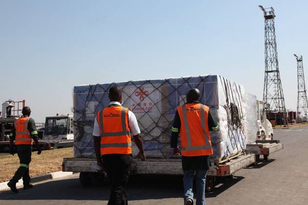 (210807) -- LUSAKA, Aug. 7, 2021 -- Workers transfer a batch of China s Sinopharm vaccines at the Kenneth Kaunda International Airport in Lusaka, Zambia, on Aug. 7, 2021. A batch of China s Sinopharm vaccines arrived in Zambia on Saturday to be part of the southern African nation s basket of COVID-19 vaccines. ) ZAMBIA-LUSAKA-CHINA-COVID-19 VACCINES-ARRIVAL ZhaoxYupeng 
