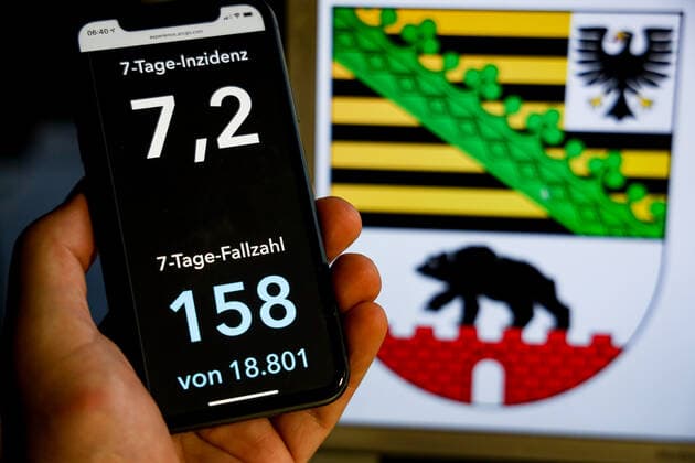 Coronavirus in Germany Covid 19 Dashboard of the Robert Koch Institute DEU, Germany, Saxony Anhalt, 08 08 2021 The 7-day incidence for the state Cases last 7 days 100 000 PE is displayed on an iPhone, with the state coat of arms in the background.