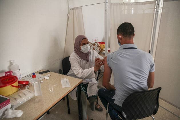 National COVID-19 Vaccination Campaign In Tunisia A man receives a dose of the AstraZeneca COVID-19 vaccine in the vaccination centre in the city of Ariana, near the capital Tunis, Tunisia, on August 8, 2021, as part of the national vaccination open days ordered by the Tunisian President Kais Saied for the benefit of all Tunisian citizens over 40 years old, as Tunisia struggles to stop the rapid spread of Coronavirus pandemic. Tunis TUNIS Tunisia benibrahim-national210808_npCmJ  Copyright: xChedlyxBenxIbrahimx