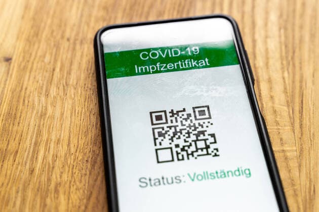 29 July 2021: Green passport Covid 19 health and vaccination certificate on the smartphone screen, Tested, Vaccinated or Recovered according to the 3 G rule