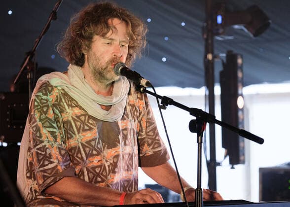 August 8, 2021, Wickham, Hampshire, United Kingdom: Irish singer, songwriter, actor and musician, Liam O Maonlai best known as the lead vocalist with Dublin band The Hothouse Flowers, playing keyboard while performing live on stage at Wickham Festival. Wickham United Kingdom - ZUMAs197 20210808_zaa_s197_222 Copyright: xDawnxFletcher-Parkx