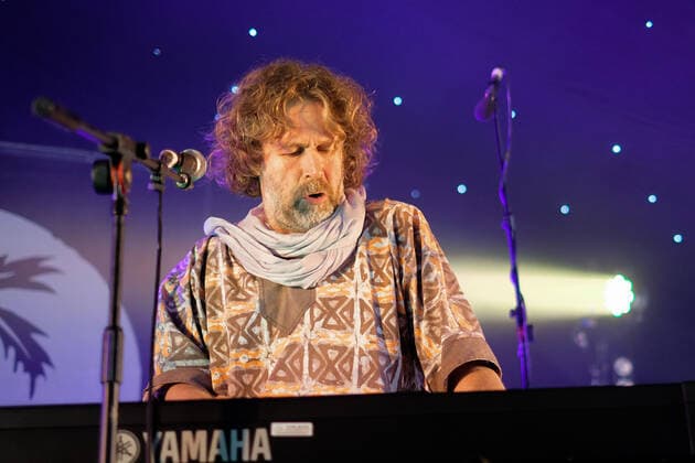 August 8, 2021, Wickham, Hampshire, United Kingdom: Irish singer, songwriter, actor and musician, Liam O Maonlai best known as the lead vocalist with Dublin band The Hothouse Flowers, playing keyboard while performing live on stage at Wickham Festival. Wickham United Kingdom - ZUMAs197 20210808_zaa_s197_227 Copyright: xDawnxFletcher-Parkx