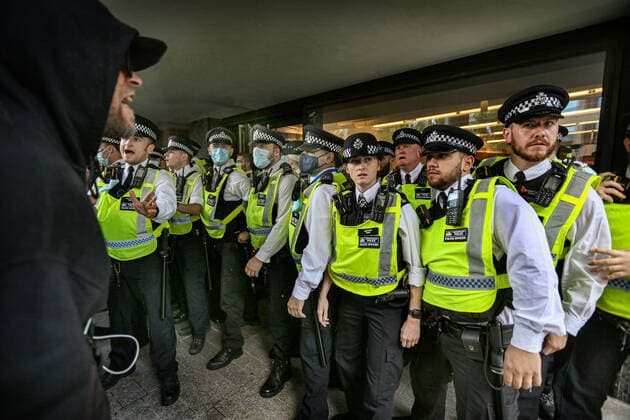 August 9, 2021, London, United Kingdom: Police officers guard access doors to Studioworks during the demonstration..Protesters held a demonstration against the mainstream media bias, covid restrictions, vaccine passports, Covid vaccination for children and the loss of freedom under the Coronavirus Act. London United Kingdom - ZUMAs197 20210809_zaa_s197_126 Copyright: xMartinxPopex