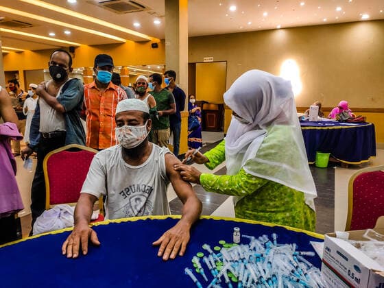 August 10, 2021, Barishal, Barishal, Bangladesh: A health worker inoculates a man with the jab of Astrazeneca Covid-19 coronavirus vaccine during a 2nd Dose Astrazeneca vaccination camp at Barishal in Bangladesh. Barishal Bangladesh - ZUMAr337 20210810_zip_r337_033 Copyright: xMustasinurxRahmanxAlvix