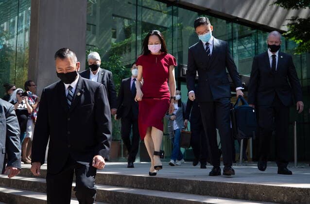 August 10, 2021, Vancouver, BC, Canada: Meng Wanzhou, centre, chief financial officer of Huawei, leaves B.C. Supreme Court during a break from her extradition hearing, in Vancouver, on Tuesday, August 10, 2021. Vancouver Canada - ZUMAc35_ 20210810_zaf_c35_034 Copyright: xDarrylxDyckx