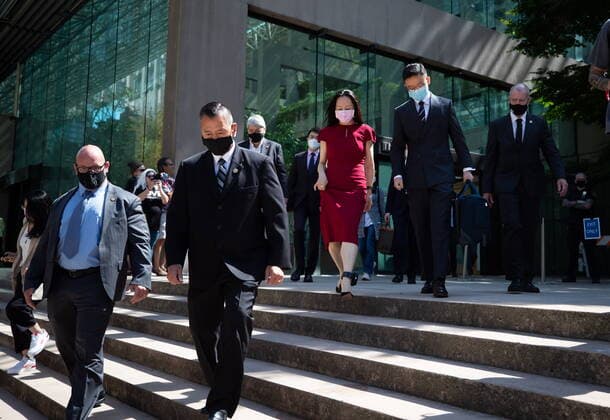 August 10, 2021, Vancouver, BC, Canada: Meng Wanzhou, centre, chief financial officer of Huawei, leaves B.C. Supreme Court during a break from her extradition hearing, in Vancouver, on Tuesday, August 10, 2021. Vancouver Canada - ZUMAc35_ 20210810_zaf_c35_030 Copyright: xDarrylxDyckx