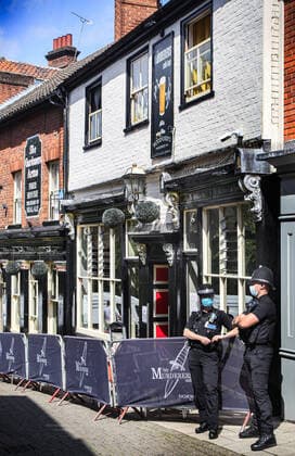 August 10, 2021, Norwich, United Kingdom: Police officers stand alert outside the Murderers pub during the demonstration..Anti vax-passport protesters visit Norwich to highlight the discrimination they believe is taking place at The Murderers pub. The landlord Phil Cutter has introduced a new no jab, no entry rule that he says protects both his staff and customers. Norwich United Kingdom - ZUMAs197 20210810_zaa_s197_283 Copyright: xMartinxPopex