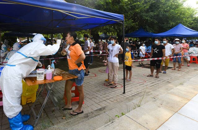 (210811) -- HAIKOU, Aug. 11, 2021 -- A medical worker takes a swab sample from a citizen at a COVID-19 nucleic acid testing site in Yunlong Township of Haikou, south China s Hainan Province, Aug. 11, 2021. Yunlong launched its thrid round of mass nucleic acid testing on Wednesday. ) CHINA-HAIKOU-YUNLONG-COVID-19-TESTING (CN) YangxGuanyu 