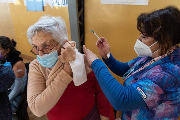 August 11, 2021, Pucon, Araucania, Chile: An older adult receives the third dose of the Covid vaccine, in the municipal gym of Pucon, in southern Chile, which has been transformed into a vaccination center against Covid. Today in Chile began the vaccination of adults over 86 years of age with the third dose. This third dose is for those who have previously received the two doses of Sinovac, and this third time it is inoculated with a dose of Astrazeneca. Pucon Chile - ZUMAb332 20210811_zip_b332_010 Copyright: xMatiasxBasualdox