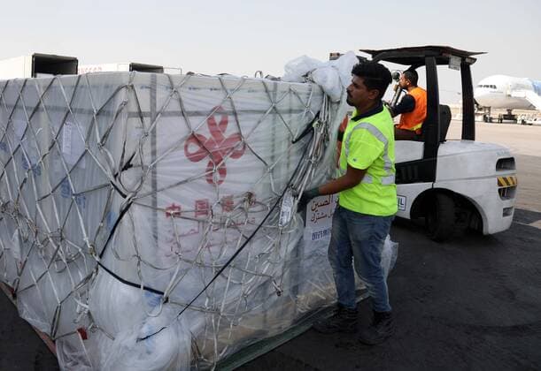 (210813) -- BAGHDAD, Aug. 13, 2021 () -- A worker transports COVID-19 vaccines at Baghdad International Airport in Iraq on Aug. 12, 2021. Iraq on Thursday received a third batch of COVID-19 vaccines donated by the Chinese government amid a surge in coronavirus infections due to the spread of the Delta variant. () IRAQ-BAGHDAD-CHINESE DONATED VACCINE-ARRIVAL Xinhua 