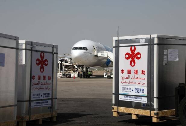 (210813) -- BAGHDAD, Aug. 13, 2021 () -- Workers transport COVID-19 vaccines at Baghdad International Airport in Iraq on Aug. 12, 2021. Iraq on Thursday received a third batch of COVID-19 vaccines donated by the Chinese government amid a surge in coronavirus infections due to the spread of the Delta variant. () IRAQ-BAGHDAD-CHINESE DONATED VACCINE-ARRIVAL Xinhua 