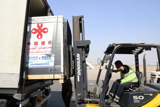 (210813) -- BAGHDAD, Aug. 13, 2021 () -- A worker transports COVID-19 vaccines at Baghdad International Airport in Iraq on Aug. 12, 2021. Iraq on Thursday received a third batch of COVID-19 vaccines donated by the Chinese government amid a surge in coronavirus infections due to the spread of the Delta variant. () IRAQ-BAGHDAD-CHINESE DONATED VACCINE-ARRIVAL Xinhua 
