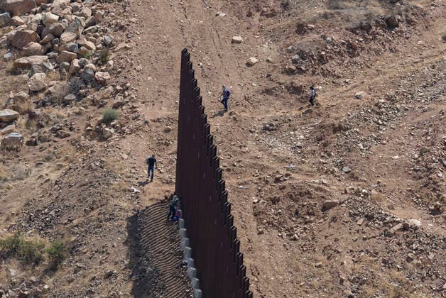 August 13, 2021, San Diego, California, USA: During a visit to the border by Republican candidate for California governor Caitlyn Jenner, four people crossed illegally into the United States through an unconstructed gap in the border fence. According to Border Patrol agents that took them into custody, they traveled from Brazil to make the crossing. San Diego USA - ZUMAb202 20210813_znp_b202_006 Copyright: xDavidxBarakx
