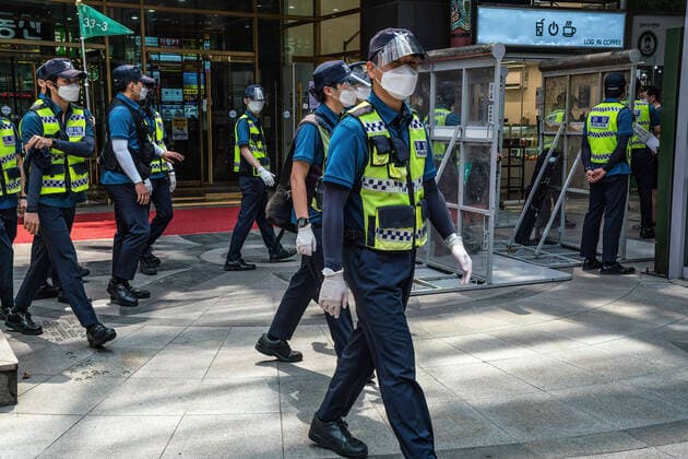 August 15, 2021, Seoul, South Korea: Police officers are seen at a checkpoint in Seoul..South Korean police sets up bus walls and checkpoints to block the protestors in Seoul. South Korea has banned protests ahead of the National Liberation Day, bewaring of revival of coronavirus outbreak caused by an anti-government rally last August. Seoul South Korea - ZUMAs197 20210815_zaa_s197_012 Copyright: xSimonxShinx