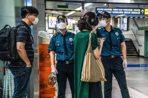 August 15, 2021, Seoul, South Korea: Police officers at Gwanghwamun station give directions to people..South Korean police sets up bus walls and checkpoints to block the protestors in Seoul. South Korea has banned protests ahead of the National Liberation Day, bewaring of revival of coronavirus outbreak caused by an anti-government rally last August. Seoul South Korea - ZUMAs197 20210815_zaa_s197_024 Copyright: xSimonxShinx