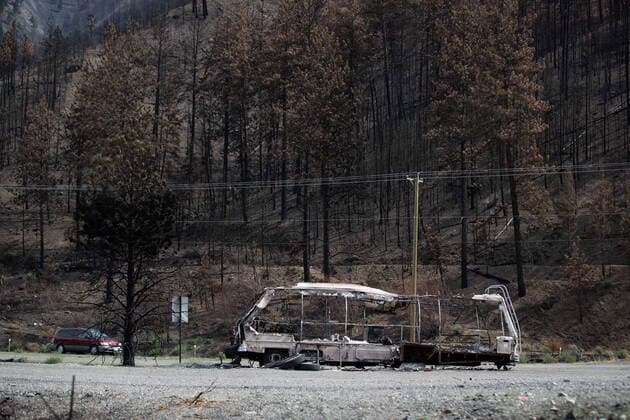 August 15, 2021, LYTTON, BC, CANADA: The remains of a recreational vehicle destroyed by the Lytton Creek wildfire is seen on the side of the Trans-Canada Highway near Lytton, B.C., on Sunday, August 15, 2021. LYTTON CANADA  - ZUMAc35_ 20210815_zaf_c35_094 Copyright: xDarrylxDyckx