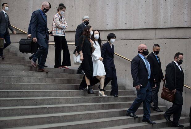 August 17, 2021, Vancouver, BC, Canada: Meng Wanzhou, centre, chief financial officer of Huawei, leaves B.C. Supreme Court during a break from her extradition hearing, in Vancouver, on Tuesday, August 17, 2021. Vancouver Canada - ZUMAc35_ 20210817_zaf_c35_045 Copyright: xDarrylxDyckx