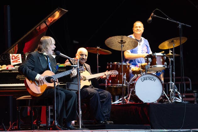 Helge Schneider with Sandro Giampietro, guitar and Thomas Alkier, drums Live performance of the entertainer and musician Helge Schneider with the program Die Wiederkehr des blaugrünen Smaragdkäfers at the Kunst Rasen Bonn, 17 08 2021 organized by E L Hartz Promotion GmbH Bonn Gronau NRW Germany