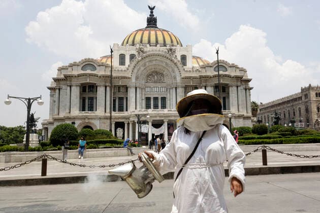 National Bee Day In Mexico MEXICO CITY, MEXICO - AUGUST 17: A beekeeper from Abejas de Barrio of Xochimilco, holds a bee smoker while protest to demand More Pollination and Less Pesticides as a campaign to protect the bees during the National Bee Day at Palace of Fine Arts on August 17, 2021 in Mexico City, Mexico. Copyright: xLuisxBarronx EYEPIXGROUP_LB_17082021_12400