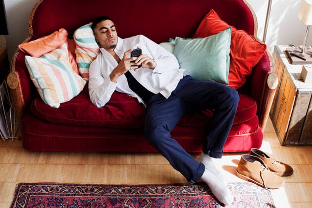 IMAGO Creative, Winter, Couching Young man lying on sofa, using smartphone RM, Nancy Honey, 2014-05-27:27, 27 05 2014 20:20, Copyright: xNancyxHoneyx, model released, leaning back,full length,attitude,laziness,at home,macho,masculine,relaxation,sofa,cushion,20 to 24 years,mixed race ethnicity,male,man,young man,only one young man,couch potato,one person,apartment interior,indoors,living room,smartphone,May 2014 Release,Young Adult,20-24 Years,Male,Men,Young Men,Attitude,Laziness,Masculine,Relaxation,One Person,Full Length,Telephone,Mobile Phone,Smart Phone,Soft Furnishing,Cushion,Furniture,Seat,Sofa,Symbol,Orthographic Symbol,Numeral,Home Interior,Domestic Room,Living Room,Indoors,Domestic Life,Man,Young Man Ref:IS49A6SN