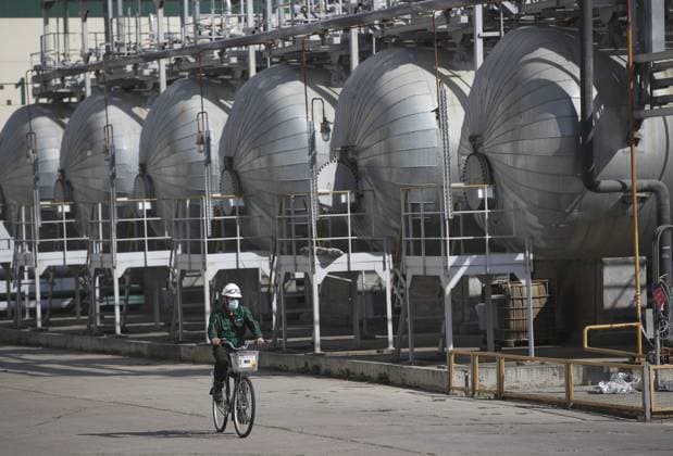 NIZHNEKAMSK, REPUBLIC OF TATARSTAN, RUSSIA â€“ AUGUST 18, 2021: An employee rides a bicycle at Tatneft s Taneco oil refining and petrochemical complex. Yegor Aleyev TASS  TS10D01C