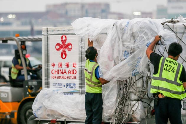 (210820) -- MANILA, Aug. 20, 2021 -- Staff members unwrap cargos containing the Sinopharm COVID-19 vaccines upon arrival in Manila, the Philippines, Aug. 20, 2021. Philippine President Rodrigo Duterte thanked China for supporting the fight against COVID-19 after a batch of Sinopharm COVID-19 vaccines donated by the Chinese government arrived in Manila on Friday. ) PHILIPPINES-MANILA-CHINA-COVID-19 VACCINE-ARRIVAL RouellexUmali 