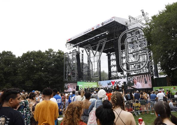 Attendees wait for the start of the We Love NYC: The Homecoming Concert In Central Park in New York City on Saturday, August 21, 2021. The Event ended abruptly when thunder storms and lightning related to Hurricane Henri moved into the area.  NYP20210821107 JohnxAngelillo
