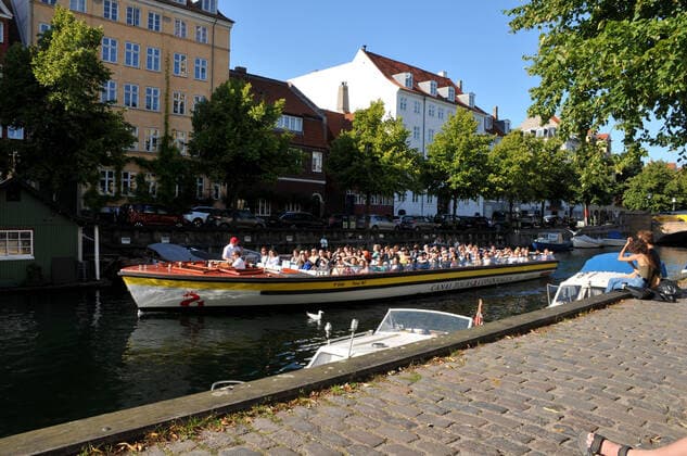 Copenhagen, Denmark. 22Aguust 2021 , touristst enjoy day on charistianhavnb canal boat cruising and out door cafe service in Christianhavn canal in Copenhagenb (Photo..Francis Joseph Dean Dean Pictures)
