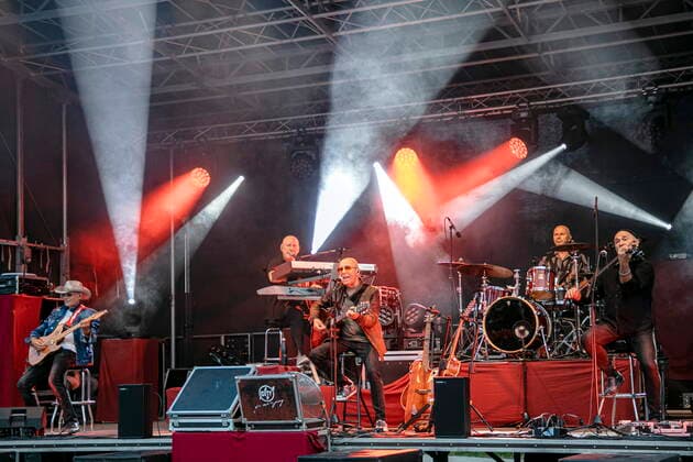 Fritz Puppel guitar , Manfred Hennig keyboards , Toni Krahl vocals, guitar , Roger Heinrich drums and Georgi Gogow violin L R of the group CITY founded 1972 in East Berlin GDR during the Candlelight Open Air rock concert live in Coswig