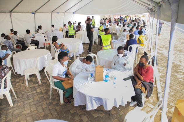 (210823) -- KIGALI, Aug. 23, 2021 -- People receive the COVID-19 vaccine at a vaccination site in Kigali, Rwanda, on Aug. 23, 2021. Rwanda on Monday started the third phase of mass COVID-19 vaccinations targeting adults 18 years and above in Kigali, the Ministry of Health said. (Photo by Xinhua) RWANDA-KIGALI-COVID-19-VACCINATION CyrilxNdegeya 