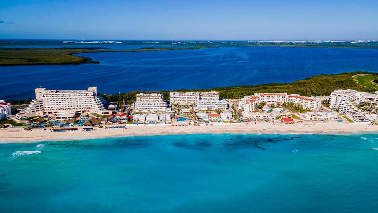 Mexico, Quintana Roo, Cancun, Aerial view of coastal city surrounded by blue waters of Caribbean Sea RUNF04629