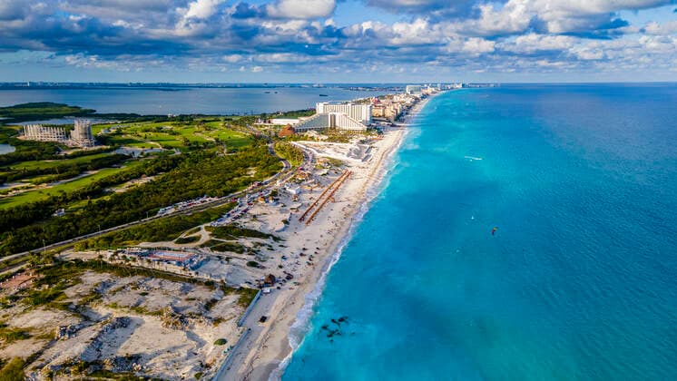 Mexico, Quintana Roo, Cancun, Aerial view of coastal city surrounded by blue waters of Caribbean Sea RUNF04632