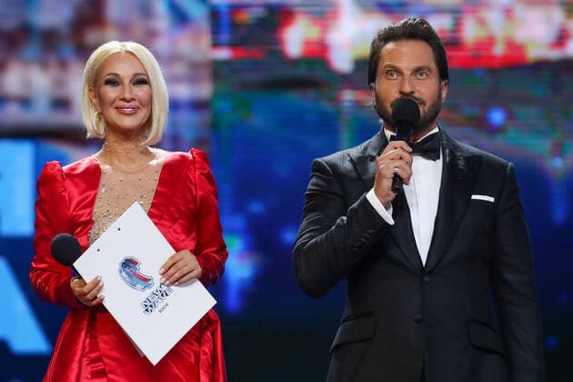 SOCHI, RUSSIA - AUGUST 25, 2021: Lera Kudryavtseva (L) and Alexander Revva host a gala concert on the closing day of the 2021 New Wave Song Contest, an international competition for young pop music performers. Eleven singers representing nine countries took part in the contest, which ran from 19 to 25 August. Vyacheslav Prokofyev TASS  TS10DC3A