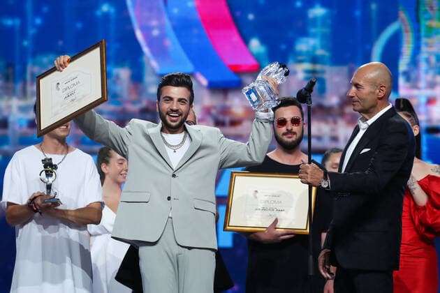 SOCHI, RUSSIA - AUGUST 25, 2021: The contest s winner, Armenian singer Saro (L front), and composer Igor Krutoi (R) are seen during the award ceremony on the closing day of the 2021 New Wave Song Contest, an international competition for young pop music performers. Eleven singers representing nine countries took part in the contest, which ran from 19 to 25 August. Vyacheslav Prokofyev TASS  TS10DC64