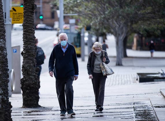 (210826) -- SYDNEY, Aug. 26, 2021 -- People walk on the street in Sydney, Australia, Aug. 26, 2021. Australia has reported more than 1,000 new COVID-19 cases for the first time since the start of the pandemic. As many as 1,123 new locally-acquired cases of COVID-19 were recorded across Australia on Thursday morning. Despite the record number of infections, Prime Minister Scott Morrison said in Canberra on Thursday that it was another day of hope with the vaccine rollout continuing to accelerate. (Photo by Xinhua) AUSTRALIA-SYDNEY-COVID-19 HuxJingchen 