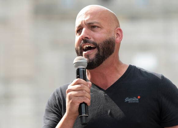 August 26, 2021, QUEBEC, PQ, Canada: CSQ president Eric Gingras speaks to a coalition of union workers demonstrating against Bill 59 on health and security for workers, at the provincial legislature in Quebec City, Thursday, Aug. 26, 2021. QUEBEC Canada  - ZUMAc35_ 20210826_zaf_c35_017 Copyright: xJacquesxBoissinotx