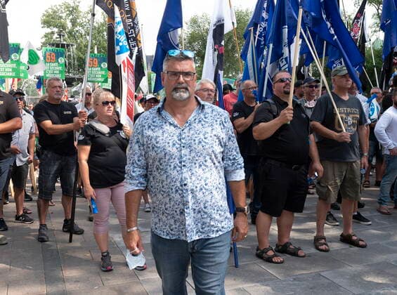 August 26, 2021, QUEBEC, PQ, Canada: SCFP president Patrick Gloutney walks to the stage as a coalition of union workers demonstrate against Bill 59 on health and security for workers, at the provincial legislature in Quebec City, Thursday, Aug. 26, 2021. QUEBEC Canada  - ZUMAc35_ 20210826_zaf_c35_021 Copyright: xJacquesxBoissinotx