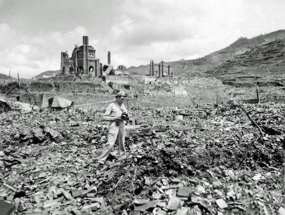 ATOMIC BOMB HIROSHIMA A photographer in front of the remains of the Urakami (St. Mary s) Cathedral in Motoomachi, Nagasaki. October 1945. The atomic bomb that fell on Nagasaki on August 9, 1945 detonated in Urakami only 500 m (1,640 ft) from the cathedral, completely destroying it. As the Feast of the Assumption of Mary (August 15) was near, well attended mass was held. The resultant collapse and heat-wave cindered and buried all those present in the Cathedral. Japan. 19451001 ! ACHTUNG: AUFNAHMEDATUM GESCHÄTZT! *** ATOMBOMBE HIROSHIMA Ein Fotograf vor den Überresten der Kathedrale von Urakami St. Mary in Motoomachi, Nagasaki Oktober 1945 Die Atombombe, die am 9. August 1945 auf Nagasaki fiel, detonierte in Urakami nur 500 m von der Kathe