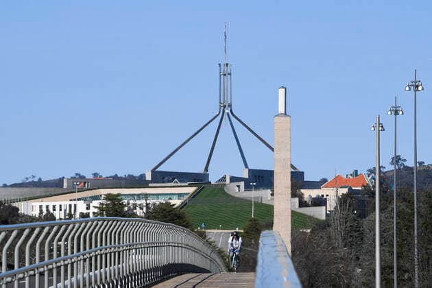 ACT CORONAVIRUS COVD19, A resident rides his bike over Commonwealth bridge near Parliament House in Canberra, Wednesday, September 1, 2021. The ACT government is extending Canberra s lockdown for another two weeks until September 17. ( NO ARCHIVING, EDITORIAL USE ONLY, NO USE IN BOOKS WITHOUT CONSENT CANBERRA ACT AUSTRALIA  Copyright: xLUKASxCOCHx 20210901001571564737
