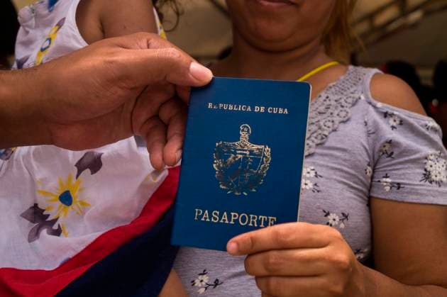 A Cuban migrant shows her Cuban pasport as thousands of Haitian, African and Cuban migrants that came from Chile, Brazil or Suriname, try to pass Colombia through the municipality of Necocli in Antioquia, Colombia towards the Colombia - Panama border by boat to then rach the United States of America. On August 6, 2021. JessicaxPatino LongxVisualxPress JPP 1059_48_jpp_cv2021_06082021_24