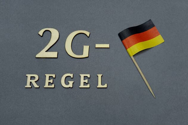 Germany flag and 2G rule Germany flag and 2G rule, 29 08 2021, Borkwalde, Brandenburg, A Germany flag lies next to the writing 2G rule