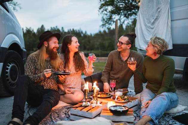 Female and male friends having food in party during evening Sweden, Gothenburg, model released, property released Copyright: xMaskotx , MA88436