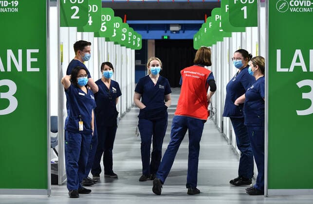 QLD CORONAVIRUS COVID19, Health care staff are seen at the new vaccination hub at the Brisbane Entertainment Centre in Brisbane, Tuesday, September 7, 2021. The Queensland government is trying to ramp up COVID-19 vaccinations before Delta reappears in the state, after bringing another outbreak under control. ( NO ARCHIVING, EDITORIAL USE ONLY, NO USE IN BOOKS WITHOUT CONSENT BRISBANE QLD AUSTRALIA  Copyright: xDARRENxENGLANDx 20210907001573516887