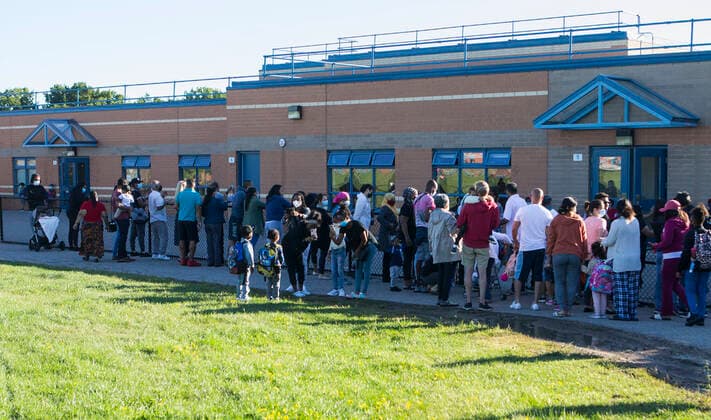 (210909) -- MISSISSAUGA (CANADA), Sept. 9, 2021 -- Parents and students arrive at a school in Mississauga, the Greater Toronto Area, Ontario, Canada, on Sept. 9, 2021. Schools in Toronto, Peel, York and Durham started their school years on Thursday, offering a mix of in-person classes and online learning for students. (Photo by Xinhua) CANADA-ONTARIO-MISSISSAUGA-COVID-19-SCHOOL-OPENING DAY ZouxZheng