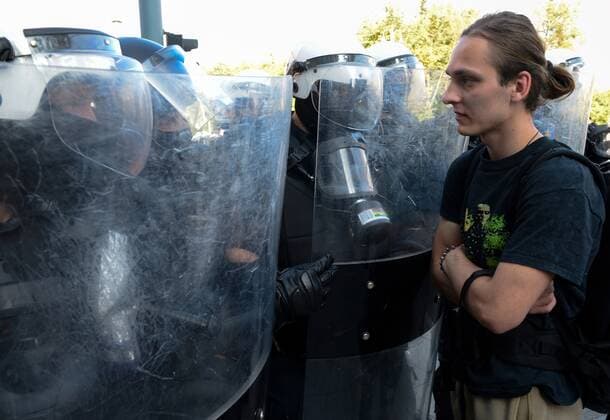 Lithuania Anti Health Pass Rally 6648066 10.09.2021 A young man stands in front of a line of riot police officers during a rally against a health pass championed by the centre-right government, in Vilnius, Lithuania. The demonstration has been organized by the Lithuanian Family Movement to contest restrictions on access to public venues and certain jobs for those who do not have coronavirus immunity certificates, which will go into effect on Monday. People were also marching against the Lithuanian bill recognizing same-sex civil unions and the implementation of the Istanbul Convention on preventing and combating violence against women. Valdemar Doveiko Sputnik Vilnius Lithuania  Copyright: xValdemarxDoveikox